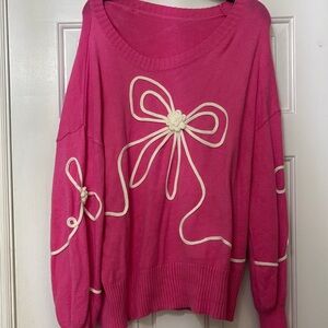 Pink Sweater with White Bow Accents